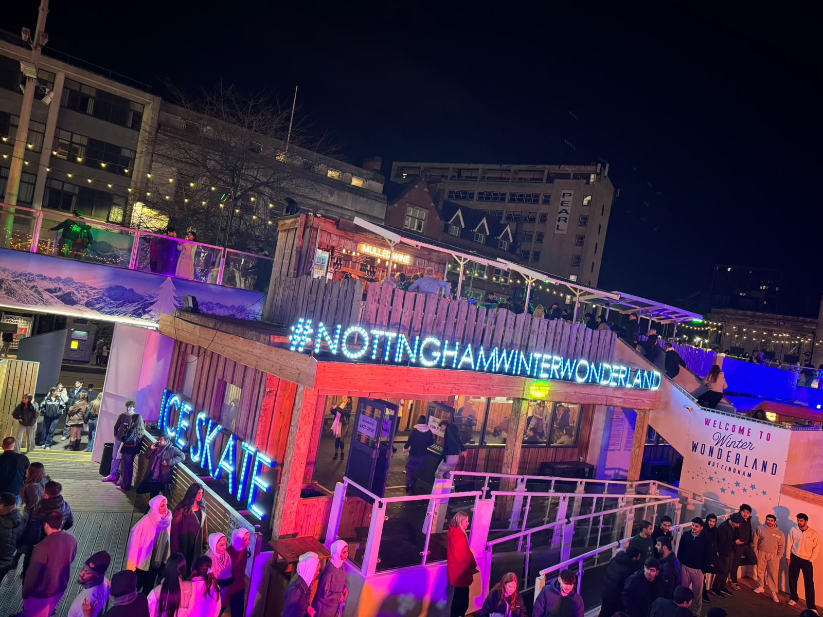 A busy winter wonderland city-centre event lit up at night, kept safe by BelvoirCare medics.