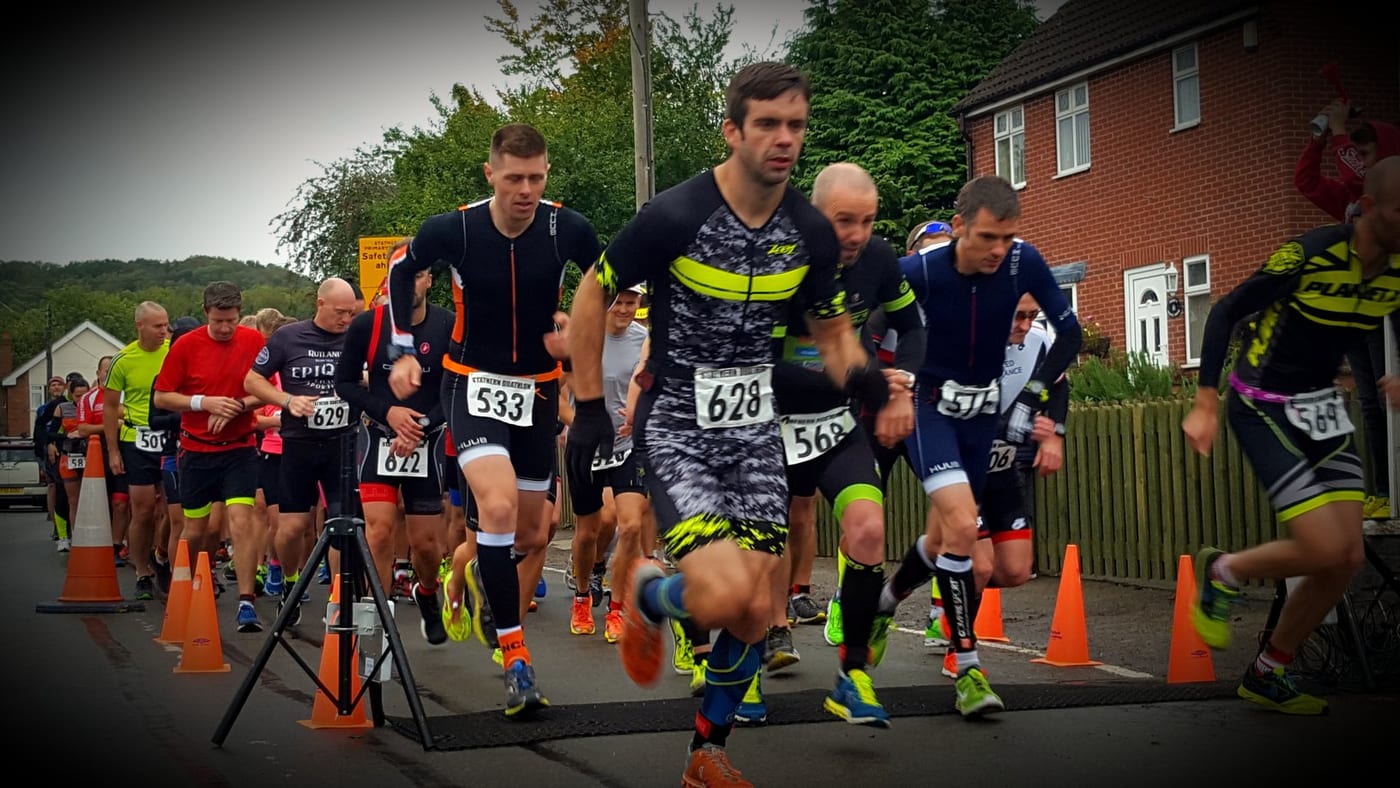 Runners setting off at the start of a local duathlon road race, with BelvoirCare medics on standby.