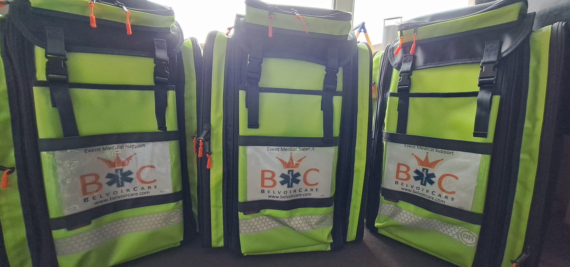 Three BelvoirCare event medical support response backpacks, fully stocked and ready for deployment at events